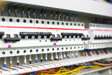 Electric circuit breaker on wall. Power equipment for electrification. Automatic switch for turning on and off high-voltage home appliances. Electric circuit breaker with black switches