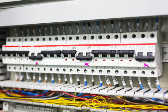 Electric circuit breaker on wall. Power equipment for electrification. Automatic switch for turning on and off high-voltage home appliances. Electric circuit breaker with black switches