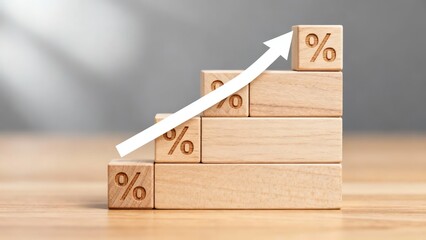 Wooden blocks with percentage symbols arranged in ascending order, featuring an upward arrow indicating growth or increase.