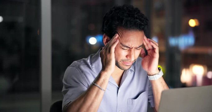 Night, man and laptop in office with headache from burnout, marketing campaign crisis and fatigue. Late, exhausted person and migraine with computer, advertising project stress and deadline pressure.