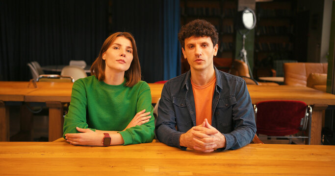 Young couple filming blog or video call looking at camera