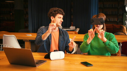Colleagues collaborating on virtual reality project in modern office