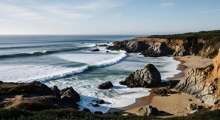 Coastal landscape with ocean waves crashing on rocky shore under sunny sky