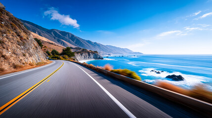 Scenic coastal highway curving along rugged cliffs with bright blue ocean waves and distant mountains