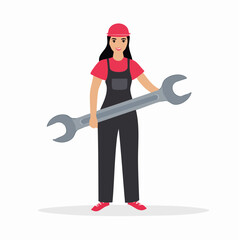 Smiling female mechanic in overalls holding large wrench standing in workshop ready to repair machinery with confidence and determination.