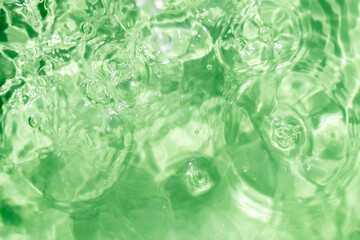 Close-up of the clear mint green water surface