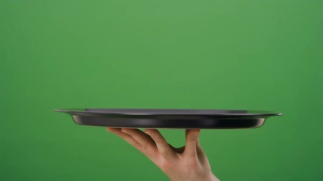Green screen hand holding empty tray for product placement