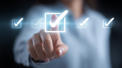 A task management concept featuring a hand pressing a glowing check mark, symbolizing verified completion, organized workflow and efficient professional decision making.
