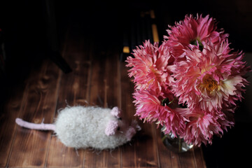 Pink Dahlia Flowers in Vase with Knitted Wool Mouse by a Wooden Window in Dalat, Vietnam