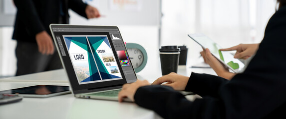 Graphic designer software for modern design of web page and commercial ads showing on the computer screen