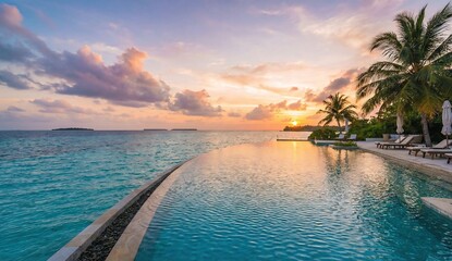 Luxury Infinity Pool Overlooking Tropical Ocean Sunset at Island Resort