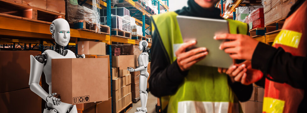 Innovative industry robot working in warehouse together with human worker . Concept of artificial intelligence for industrial revolution and automation manufacturing process .