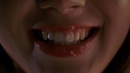 Close up of Woman Lips with Glossy Red Lipstick