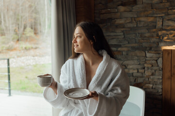 Cozy morning in a cabin with coffee and a view of nature
