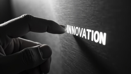 Innovative concept with hand touching word INNOVATION on textured surface, symbolizing creativity and progress
