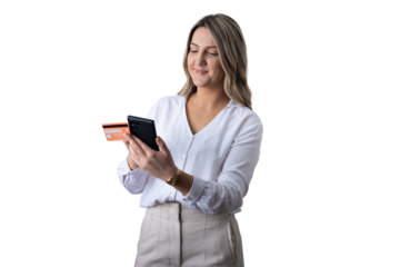 Young woman doing online shopping holding credit card and phone