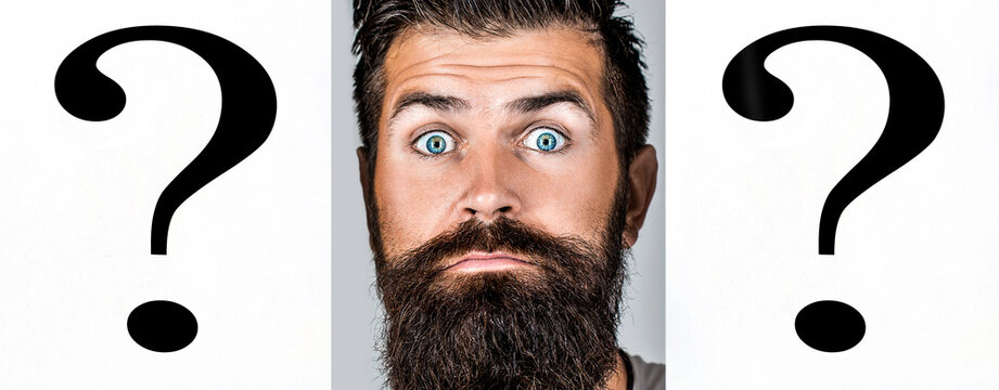 Paper notes with question marks. Man with a question mark on paper. Man holding question mark. Doubtful girl asking questions to himself