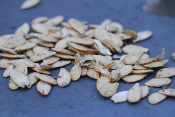 Pumpkin seeds that are kept for drying in the sun which later can be used to consume or replant