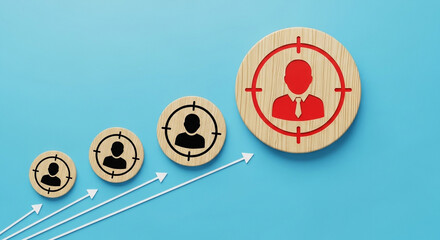 Target audience growth shown with wooden target icons and upward arrows on a blue background illustrating business success and customer acquisition strategies for marketing campaigns