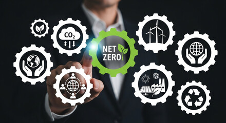 Businessman touches net zero icon symbolizing environmental sustainability renewable energy carbon neutrality and corporate responsibility for a greener future and climate action goals