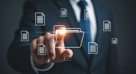 Businessman interacts with digital document management system accessing files and folders through a virtual interface for efficient data organization and workflow automation in a modern office setting