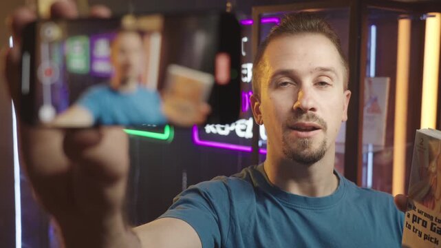 Manga influencer talking about the comic recording video with smartphone 4K