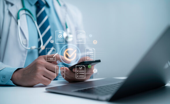 Doctor reviewing digital documents and approval checklists on mobile device illustrates efficient medical administration, secure data management and streamlined workflow in modern healthcare systems