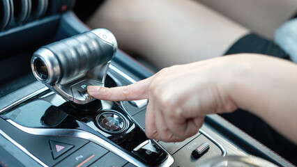 Action of a car driver's finger is pressing on 