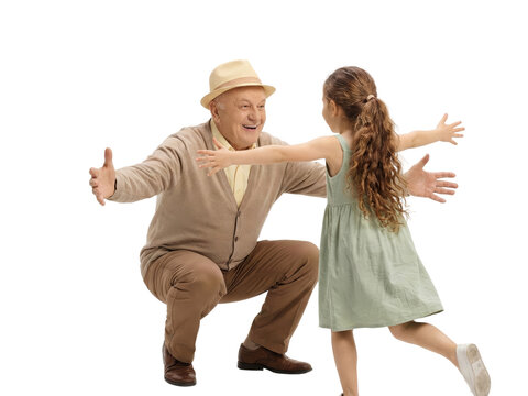 Grandfather with open arms awaiting a joyful embrace from his granddaughter isolated against