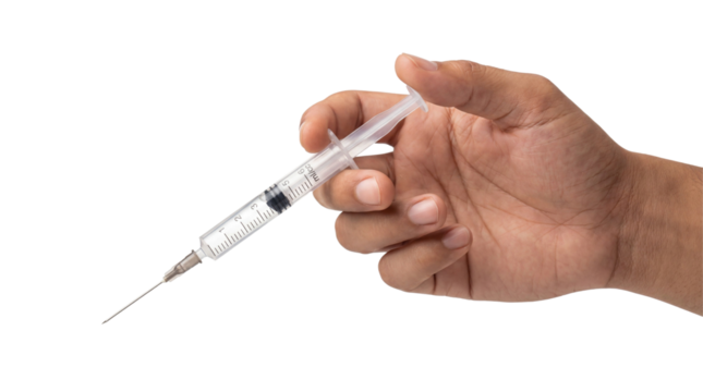 Hand holding medical syringe with needle on white or transparent background.