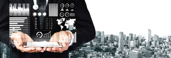 A businessman stands against a city skyline, presenting digital graphs and statistics to highlight data analysis and modern technology in business. Impute