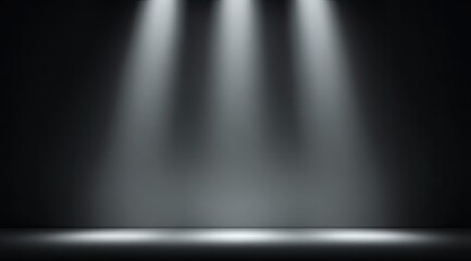 A dark backdrop is illuminated by three white beams, casting light onto a floor