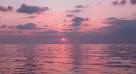 Fototapeta premium Soft, pastel sunset over a placid ocean
