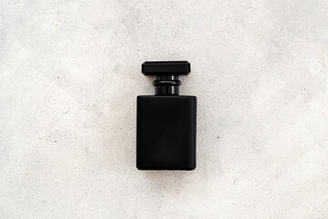 Black man perfume bottle top view. Male fragrance concept