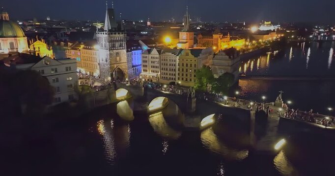 Aerial view of Prague at night. The most beautiful view of the Charles Bridge at night and beautifully illuminated by lights. Czech Republic