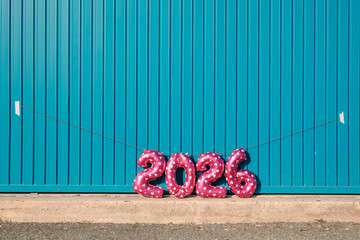 a row of balloons forming the number 2026