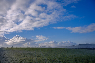 Beautiful sunny and cold December morning in the south west, UK. Low lying mist being slowly burnt back by bright autumn, winter sunshine