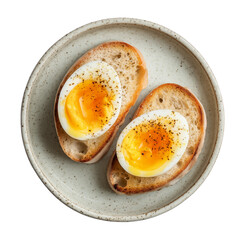 Soft-boiled egg halves with creamy yolk and pepper on toast, ready for breakfast