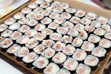 Delicious tuna sushi rolls neatly arranged and ready to serve in a brown tray