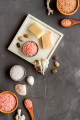 Set of body care cosmetics products with essential oil scrubs and sea salt, top view. Aromatherapy spa products