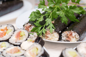 Sushi symphony a culinary masterpiece of salmon rolls and tuna maki dancing on a plate with fresh parsley