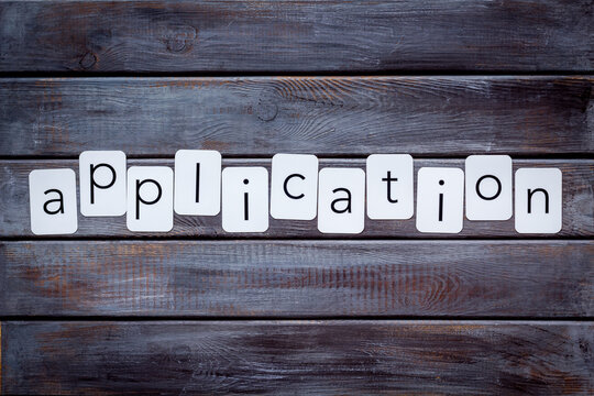 Paper cards with the text Application, top view.