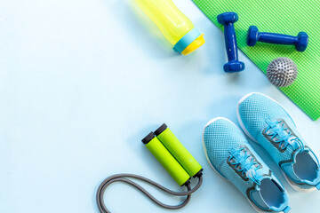 Sport fitness tolls flat lay with sneakers and dumbbells, top view