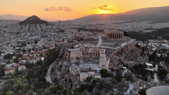 ancient Acropolis in Athens drone view at sunrise, orbiting shot of antique Parthenon, Greek history, world heritage site in Athens