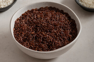 Bowl of long wholemeal red rice.