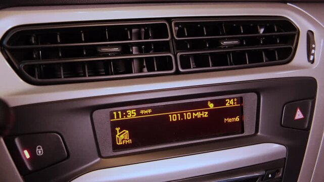 Digital car stereo display automatically searching and scanning for available fm radio stations