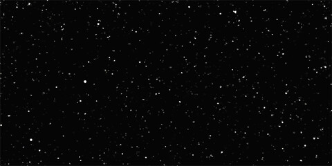 Obraz premium Falling snow flakes against a dark, cosmic night sky of sparkling star dust and light