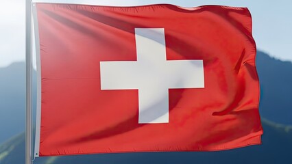 Obraz premium The national flag of Switzerland waving gracefully in the wind with a scenic mountain landscape in the background