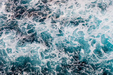 Turquoise and deep blue sea with minimalist geometric wave shapes