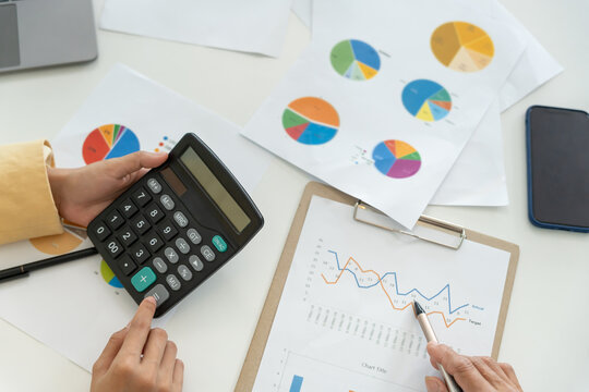 Business team calculate benefit, working woman, spreadsheets, graph financial development, bank accounts, statistics, economy, data analysis, investment analysis, stock exchange, rates income